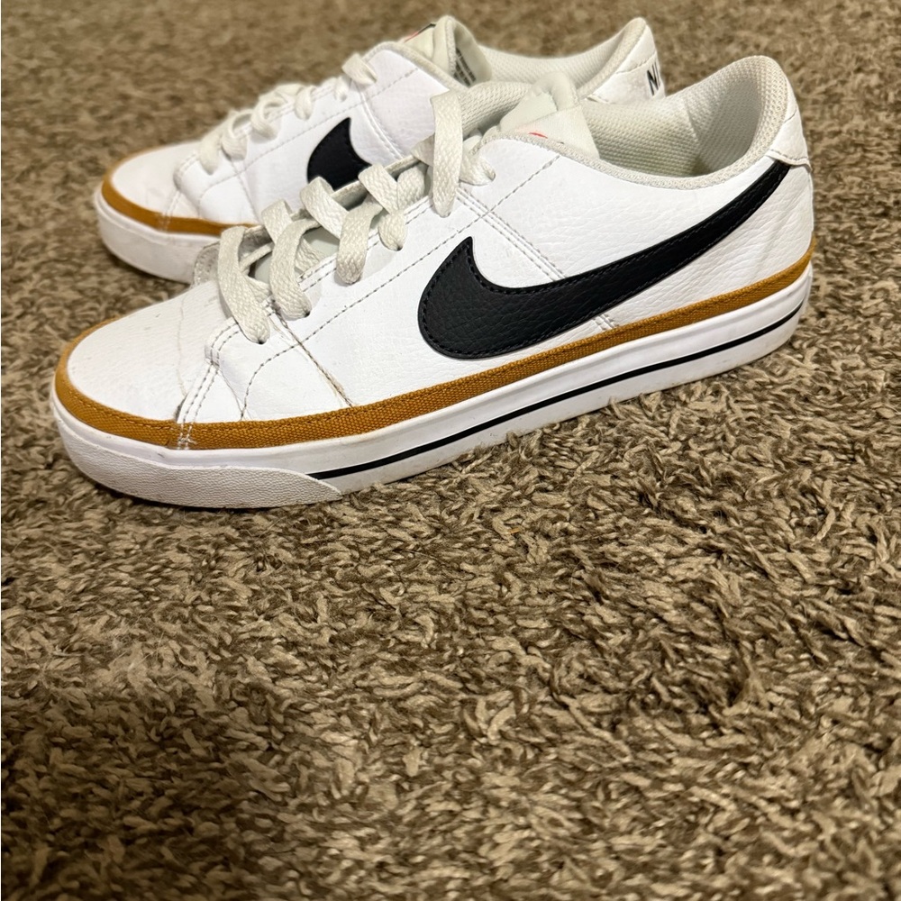 Nike Classic White Sneakers with Black and Gold Details